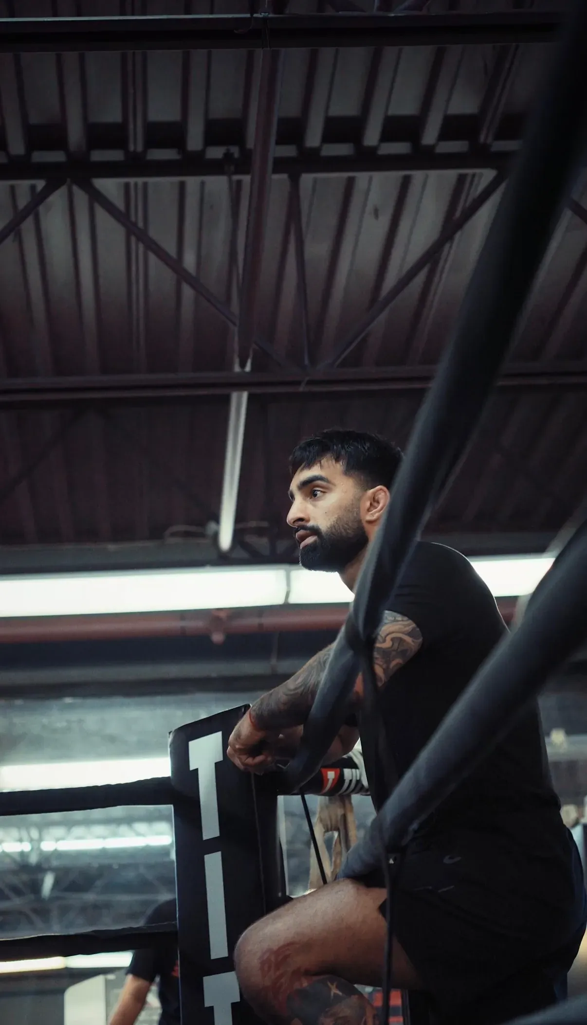 A coach watching from the ring at Matrix Boxing Abbotsford