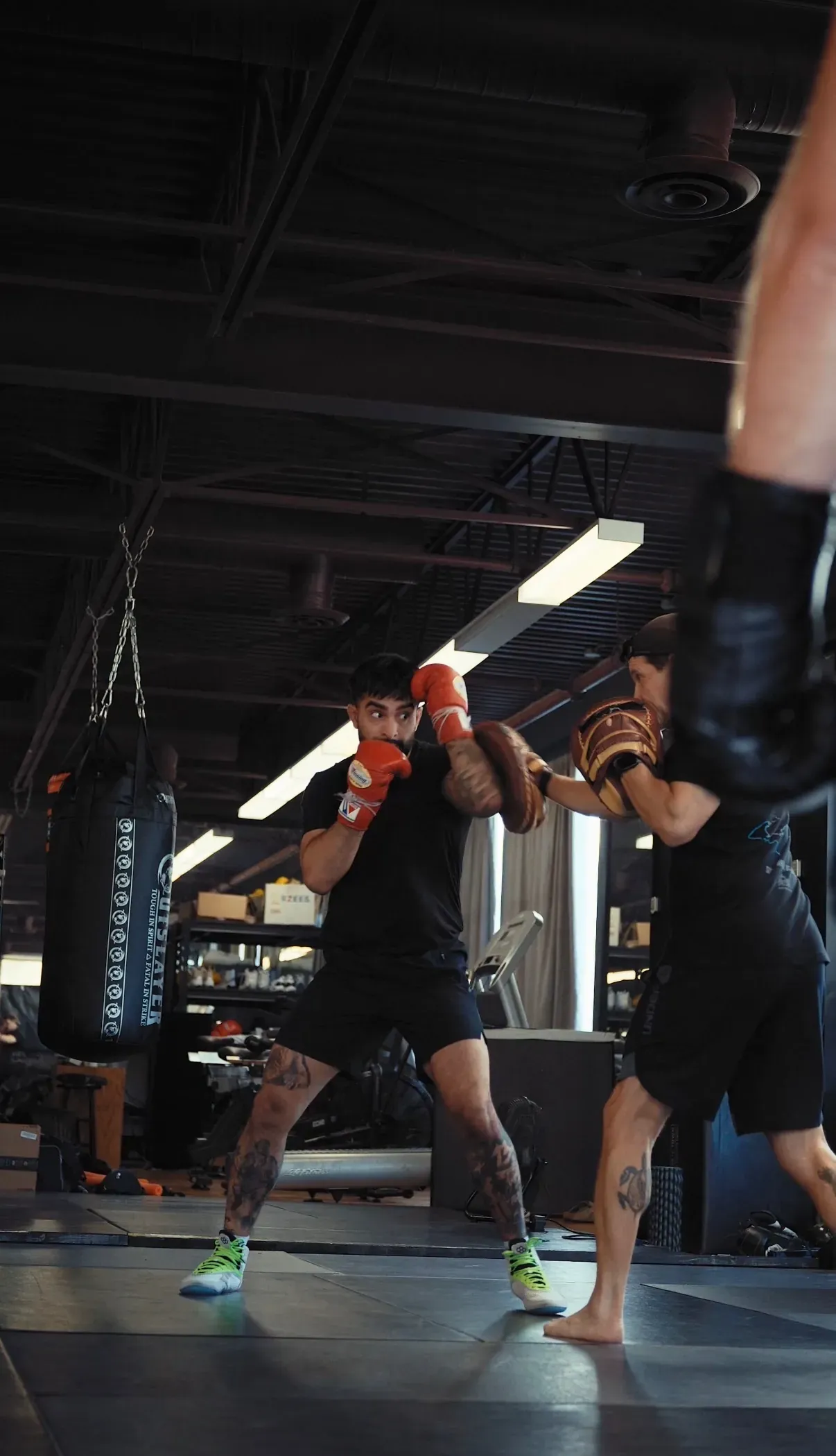 Coach and member during pad work